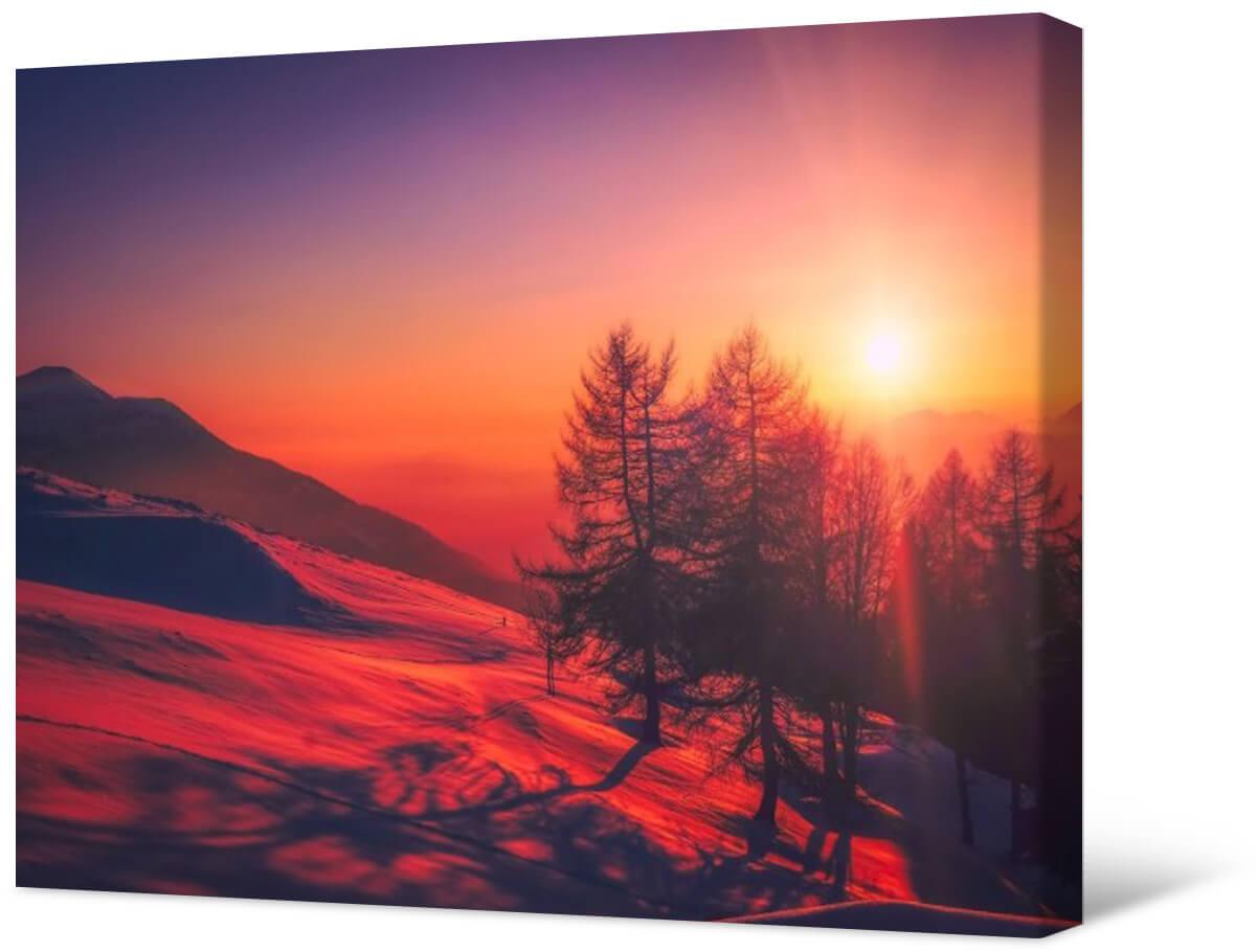 Bild Fotomalerei auf Leinwand - Sonnenuntergang über den verschneiten Bergen